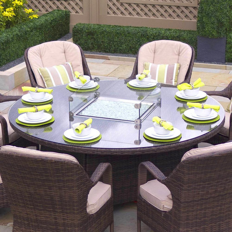 Round outdoor dining best sale table with fire pit